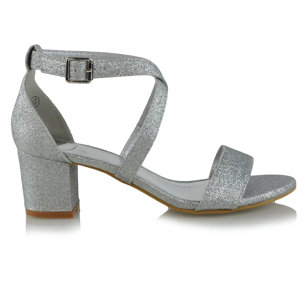 JORDYN CROSS OVER BUCKLE STRAP CHUNKY LOW BLOCK HEELS IN SILVER GLITTER
